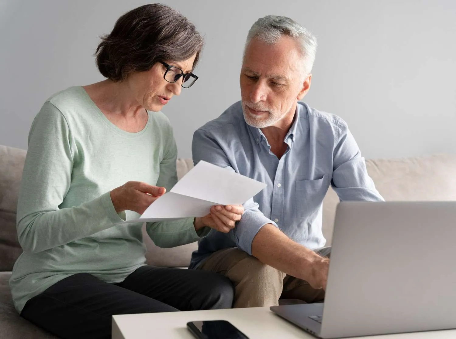 An older couple going through their Medicare paperwork together